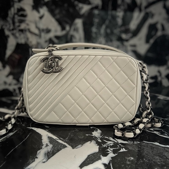 CHANEL Handbags - CHANEL Lambskin Quilted Mini Coco Boy Camera Bag White